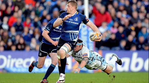 Leinster's Jamie Heaslip gets away from Ryan Grant