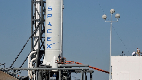 SpaceX's Falcon 9 spacecraft, with the Dragon reusable capsule, sits on the launch pad yesterday