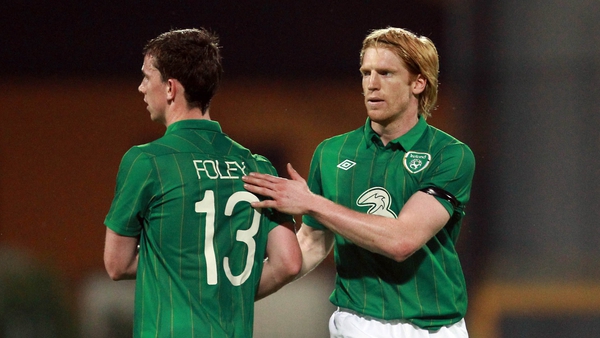 One out, one in: Paul McShane shakes hands with Kevin Foley after Ireland's 5-0 victory over a Tuscany selection on Tuesday night