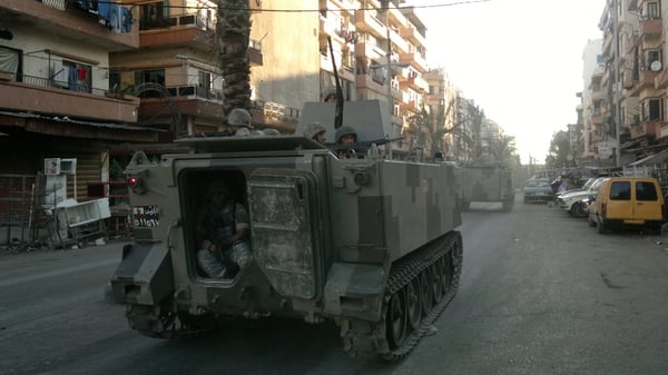 Lebanese army troops patrol the streets of Tripoli's Sunni Muslim neighbourhood of Bab al-Tabbaneh