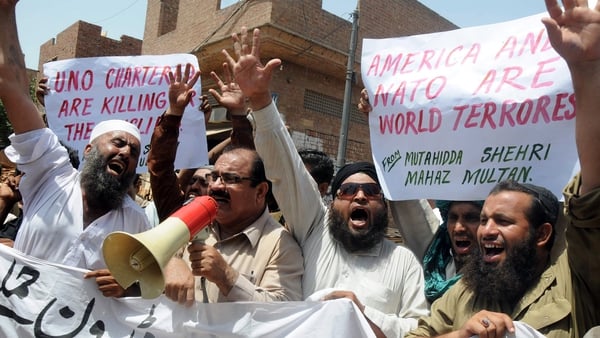 Pakistani protesters shout anti-US slogans rallying against US drone attacks in the Pakistani tribal belts during a demonstration in Multan yesterday