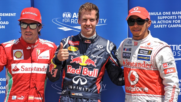 Sebastian Vettel claimed pole in Canada ahead of Lewis Hamilton (r) and Fernando Alonso (l)