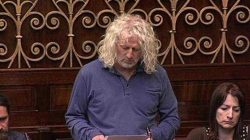 Mick Wallace (centre) and Clare Daly (right) were arrested by airport police at Shannon Airport