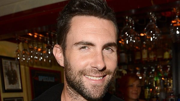 Maroon 5 frontman Adam Levine has apologised for postponing the gigs