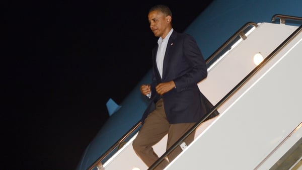 Barack Obama disembarks Air Force One on his way to the G20 summit in Mexico