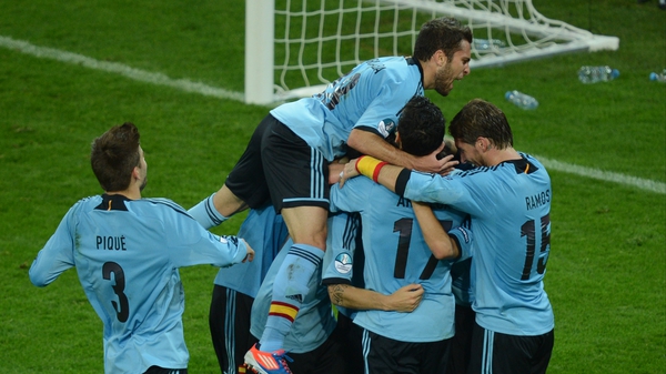 The Spanish players celebrate Jesus Navas' 88th-minute winner