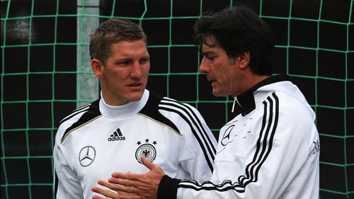Bastian Schweinsteiger (l) and Joachim Loew deep in discussion during training in Gdansk yesterday