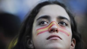 A Spanish supporter watches anxiously as her side struggles to break down a stubborn Portugal outfit