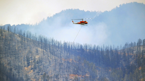 Firefighting efforts have been hampered by strong winds