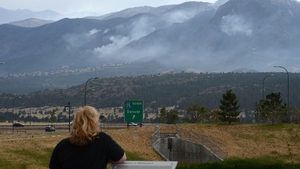 A Colorado resident watches smoke in the distance from the Waldo Canyon blaze