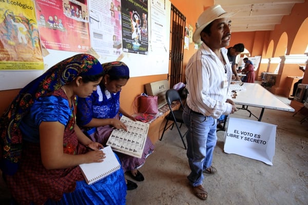 Mexicans wait in Oaxaca to cast their vote