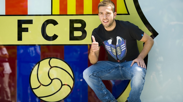 Jordi Alba poses for photographs after his Camp Nou switch