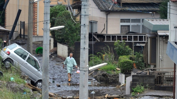 Rivers burst their banks and flooded towns and villages in the main southern island of Kyushu