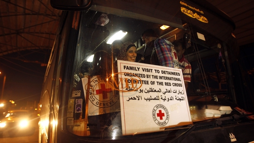 Relatives of Palestinian prisoners in Israeli prisons cross by bus at the Erez border crossing in Beit Hanun