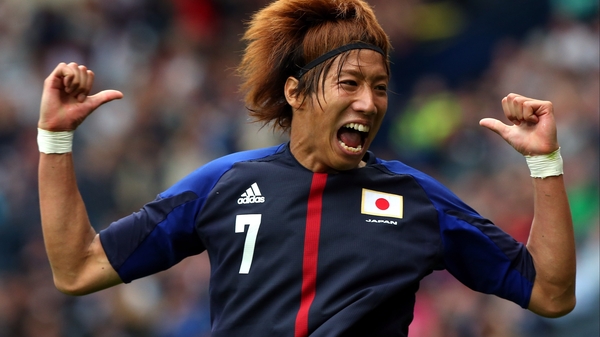 Yuki Otsu celebrates scoring the crucial goal at Hampden Park