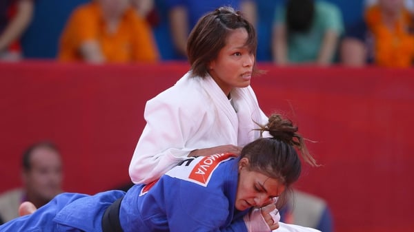 Kaori Matsumoto of Japan (white) competes with Kifayat Gasimova of Azerbaijan