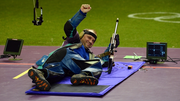 Sergei Martynov cracks a smile after winning gold