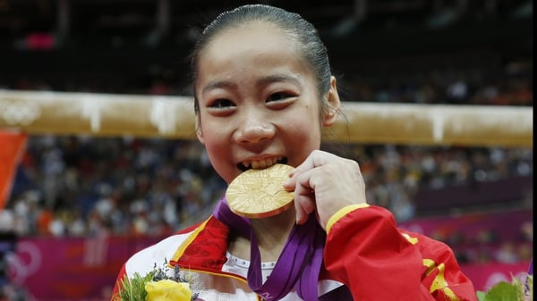 It's real! Deng Linlin celebrates after winning gold