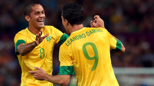 Leandro Damiao of Brazil (9) celebrates with Romulo