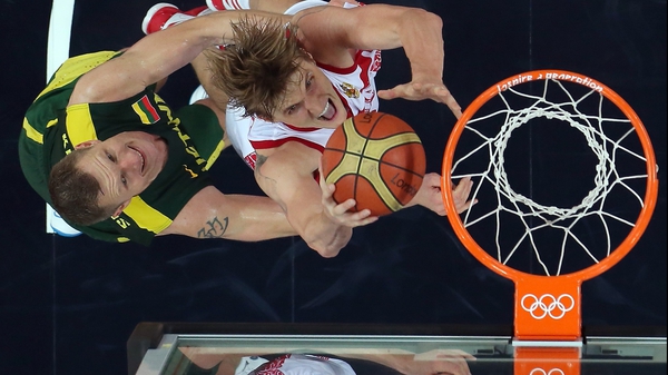 Andrey Kirilenko of Russia goes up for a shot against Rimantas Kaukenas of Lithuania
