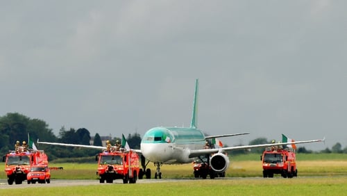 The plane carrying Team Ireland was escorted by the airport fire service on the runway at Dublin Airport