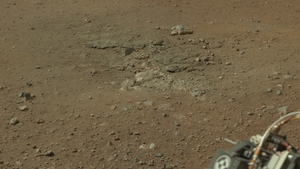 A photo shows where Curiosity's landing exhaust uncovered some bedrock