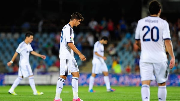 Dejected Real Madrid players leave the pitch at full-time