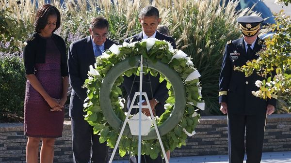 President Barack Obama lays a wreath while flanked by his wife Michelle Obama, Secretary of Defense Leon Panetta and Chairman of the Joint Chiefs of Staff Gen
 Martin Dempsey (R)