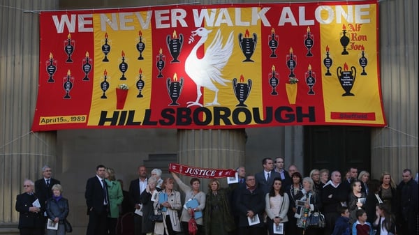 Relatives and friends of the the victims of the disaster take part in a vigil outside Liverpool's St George's Hall