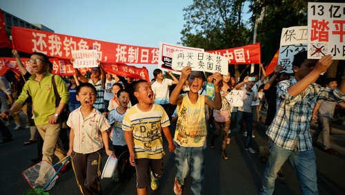 Chinese protesters stage an anti-Japan rally outside the Japan Embassy yesterday