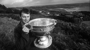 Donegal captain Anthony Molloy shows the Sam Maguire around where it would reside for the winter