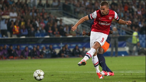 Lukas Podolski scores Arsenal's first goal in France