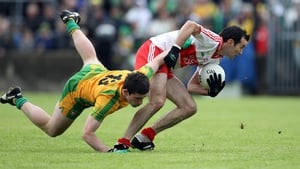 Eugene Scullion shrugs off the challenge of Donegal's Patrick McBrearty