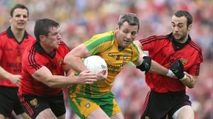 Donegal's Christy Toye is surrounded by Down duo Conor Laverty and Liam Doyle in the Ulster decider at Clones