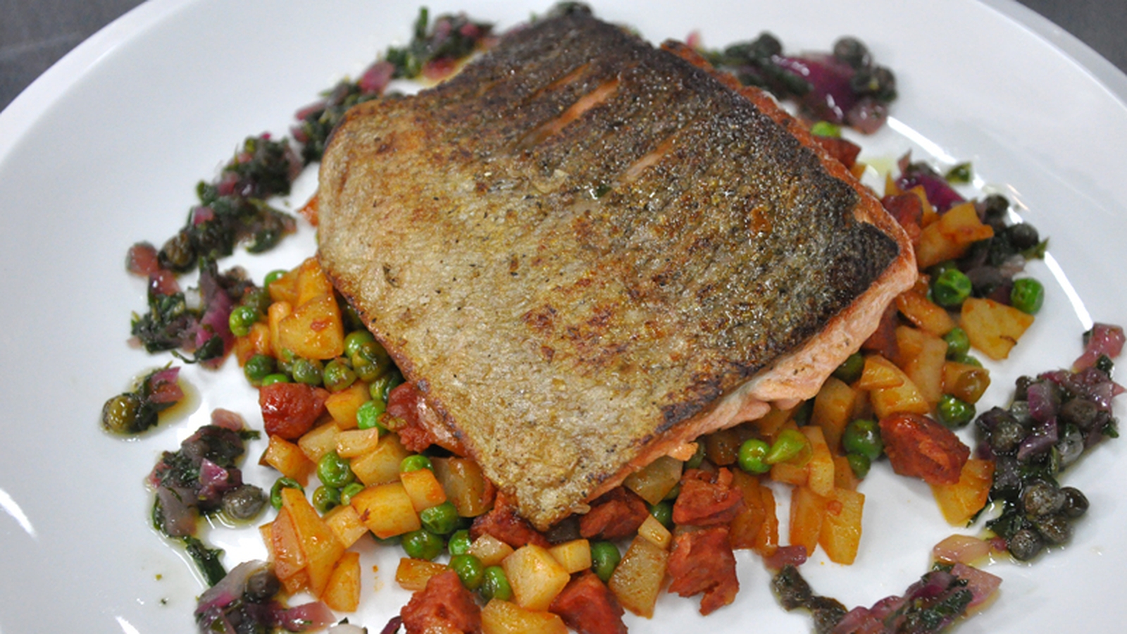 Pan-fried sea trout, peas and chorizo fricassee