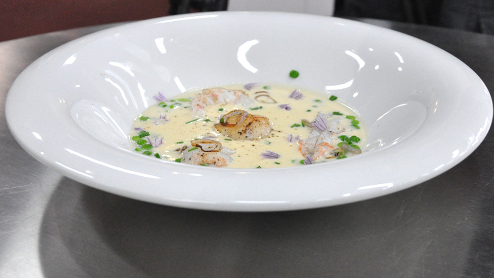 Velouté with scallop, langoustine, pea and caramel