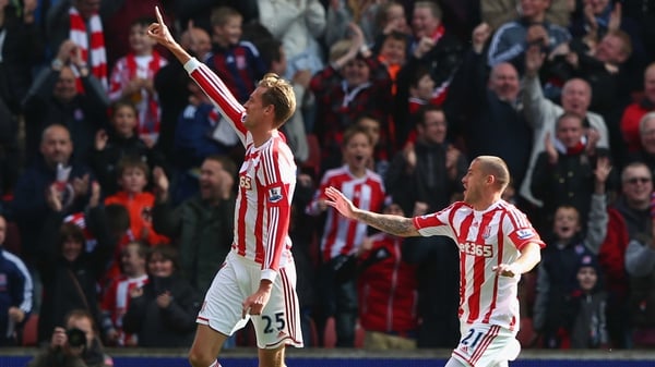 Peter Crouch and Michael Kightly celebrate