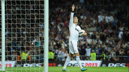 Ronaldo celebrates with the match ball