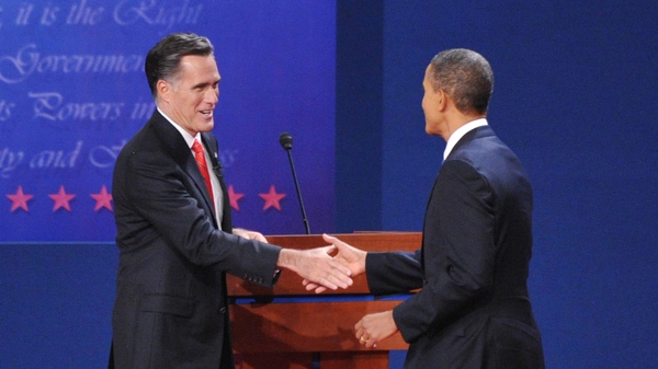 Mitt Romney and Barack Obama shake hands at the conclusion of the first presidential debate at the University of Denver