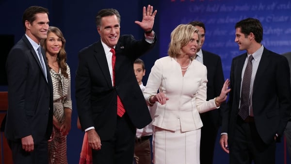 Mitt Romney and his wife Ann stand with their family after the debate in Denver