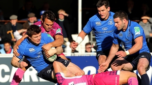 Brian O'Driscoll is tackled by Jason Shoemark and Phil Dollman