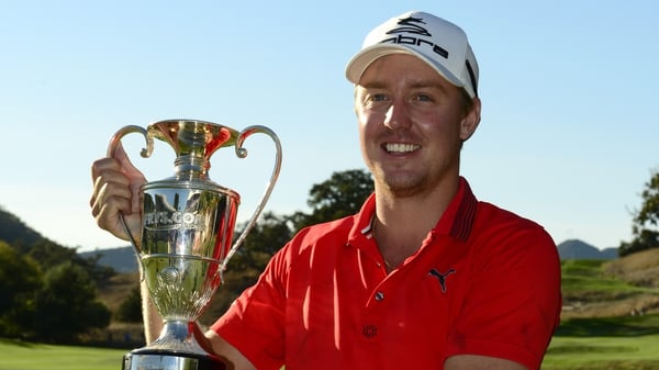 Jonas Blixt of Sweden poses with the trophy after winning the Frys.com Open