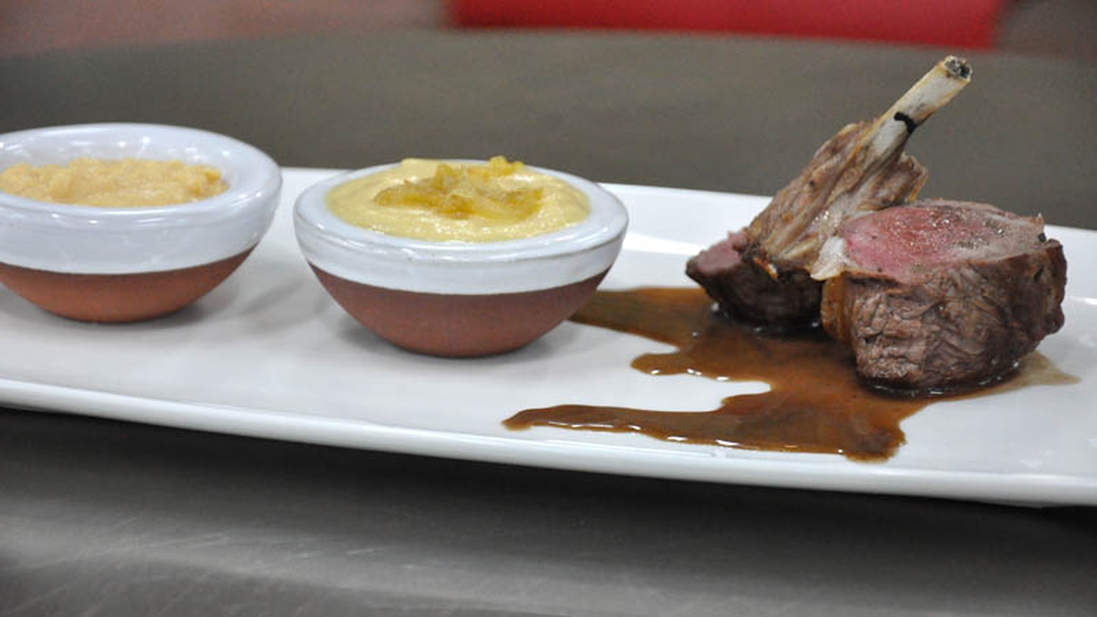 Rack of lamb with a selection of hummus dips