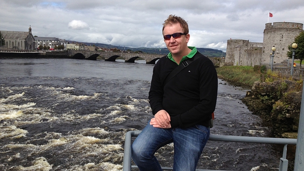 Ed Leahy, sitting by the Broad Majestic Shannon with King John's Castle in background