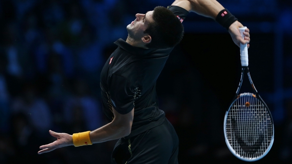 Novak Djokovic serves against Andy Murray