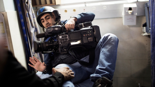 Ajab al-Shorafa, a cameraman for Press TV network, is examined in a Gazan hospital following the strike on the TV station
