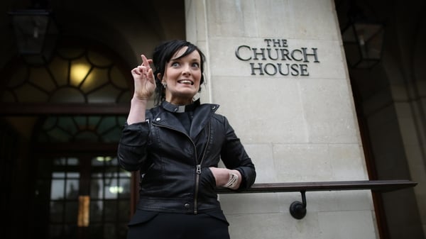 Reverend Sally Hitchiner crosses her fingers outside Church House in advance of a vote on woman bishops