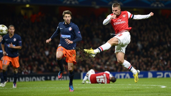 Lukas Podolski unleashed a viscous volley to give Arsenal a two-goal advantage at the Emirates
