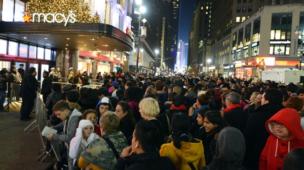 Crowds gather outside Macy's in New York ahead of the midnight opening to start the stores' 'Black Friday' shopping weekend