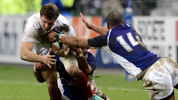 France winger Vincent Clerc is tackled by Samoa's Paul Perez